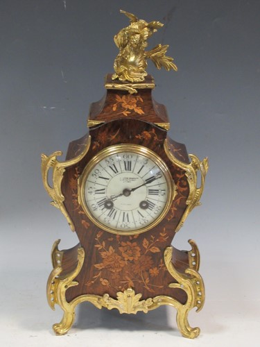 Lot 136 - A Louis XV style gilt metal mounted mantel...