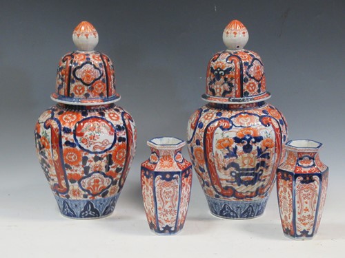 Lot 102 - A pair of late 19th century lidded Imari vases...