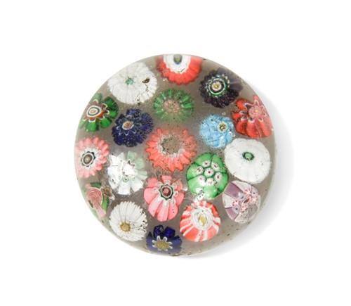 Lot 21 - A Clichy spaced millefiori glass paperweight