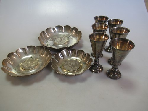 Lot 225 - A set of six silver shot goblets together with...