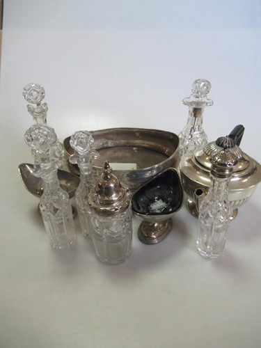 Lot 222 - A silver mounted cruet stand with bottles,...