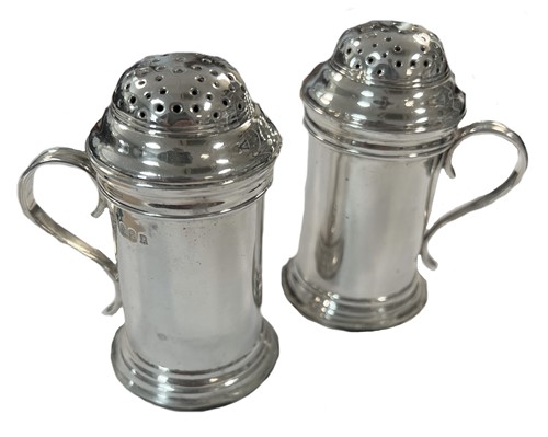 Lot 414 - A pair of early 20th century Britannia silver bun top spice casters