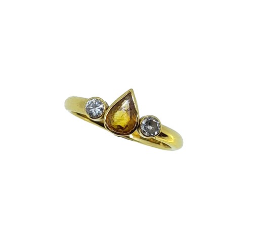 Lot 14 - An 18ct gold yellow sapphire and diamond ring