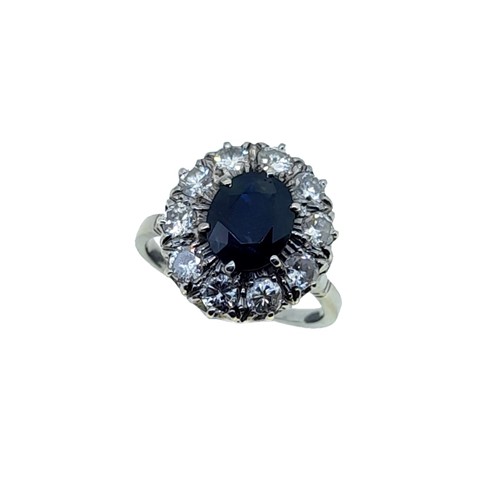 Lot 207 - A sapphire and diamond cluster ring