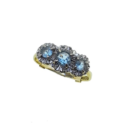 Lot 130 - An 18ct gold aquamarine and diamond dress ring
