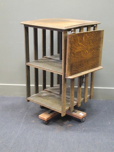 Lot 503 - An Edwardian oak revolving bookcase, with...