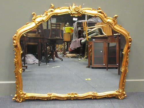 Lot 498 - A Rococo style gilt framed wall mirror of...