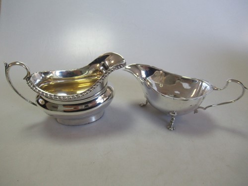 Lot 229 - A silver cream jug and a silver sauce boat...