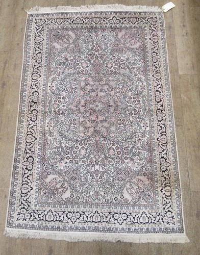 Lot 601 - A pale ground silk rug of Persian design, 194...