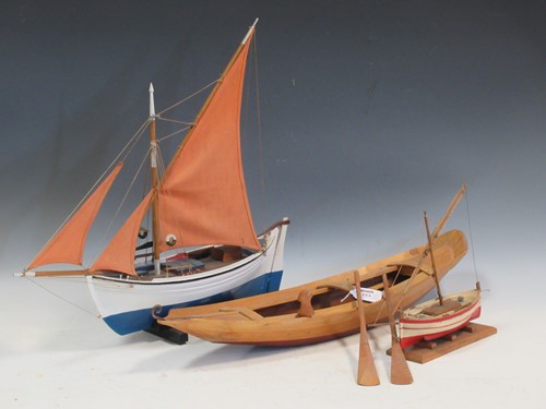 Lot 153 - A painted wood model of a Greek sailing boat,...