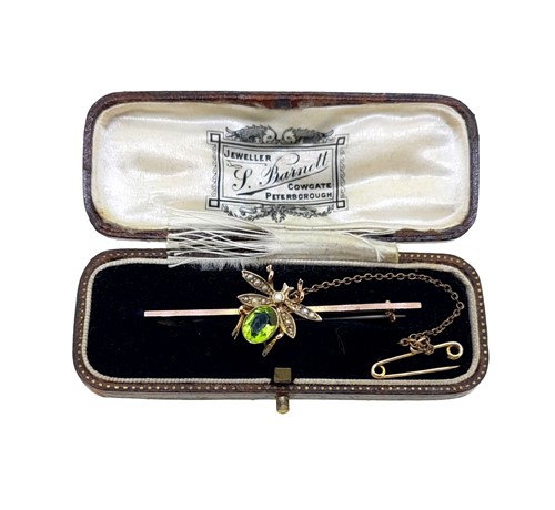 Lot 178 - A demantoid garnet and split pearl insect brooch