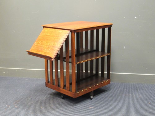 Lot 370 - A late Victorian oak revolving bookshelf with...