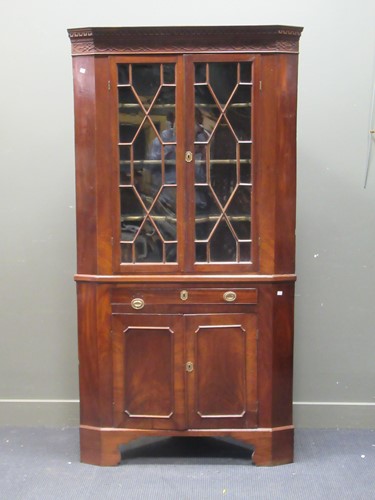 Lot 452 - A George III style mahogany two section corner...