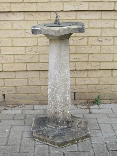 Lot 555 - A sundial on a composite base, 89cm high