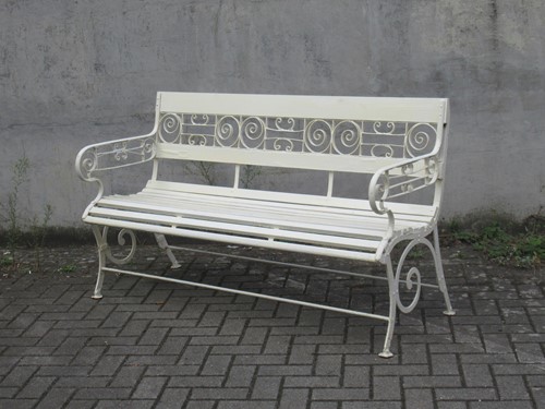Lot 556 - A white painted garden bench, 86 x 150 x 57cm