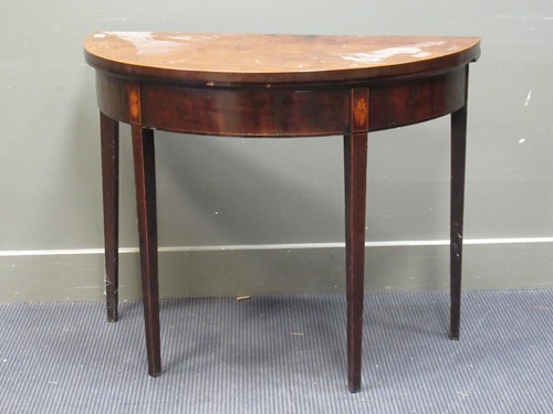 Lot 431 - A late George III mahogany fold over top...