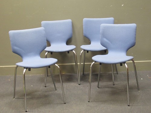 Lot 522 - A set of four blue upholstered Danish stacking chairs