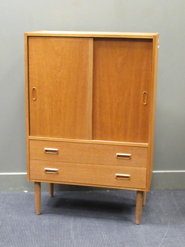 Lot 523 - Golden oak finish cabinet on tapering cylindrical legs