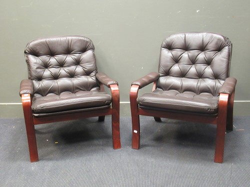 Lot 526 - A pair of Danish brown leather upholstered easy armchairs