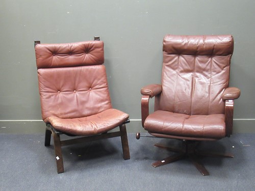 Lot 527 - A Farstrup Danish easy chair with brown leather cushions and another swivel easy chair