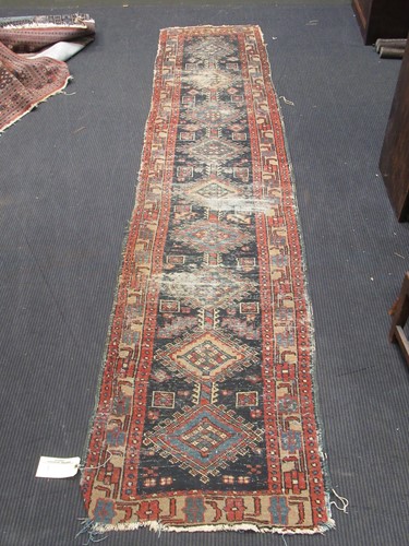 Lot 567 - A Persian blue ground runner, 314 x 69cm;...