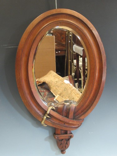 Lot 470 - An early 20th century oak framed wall mirror...