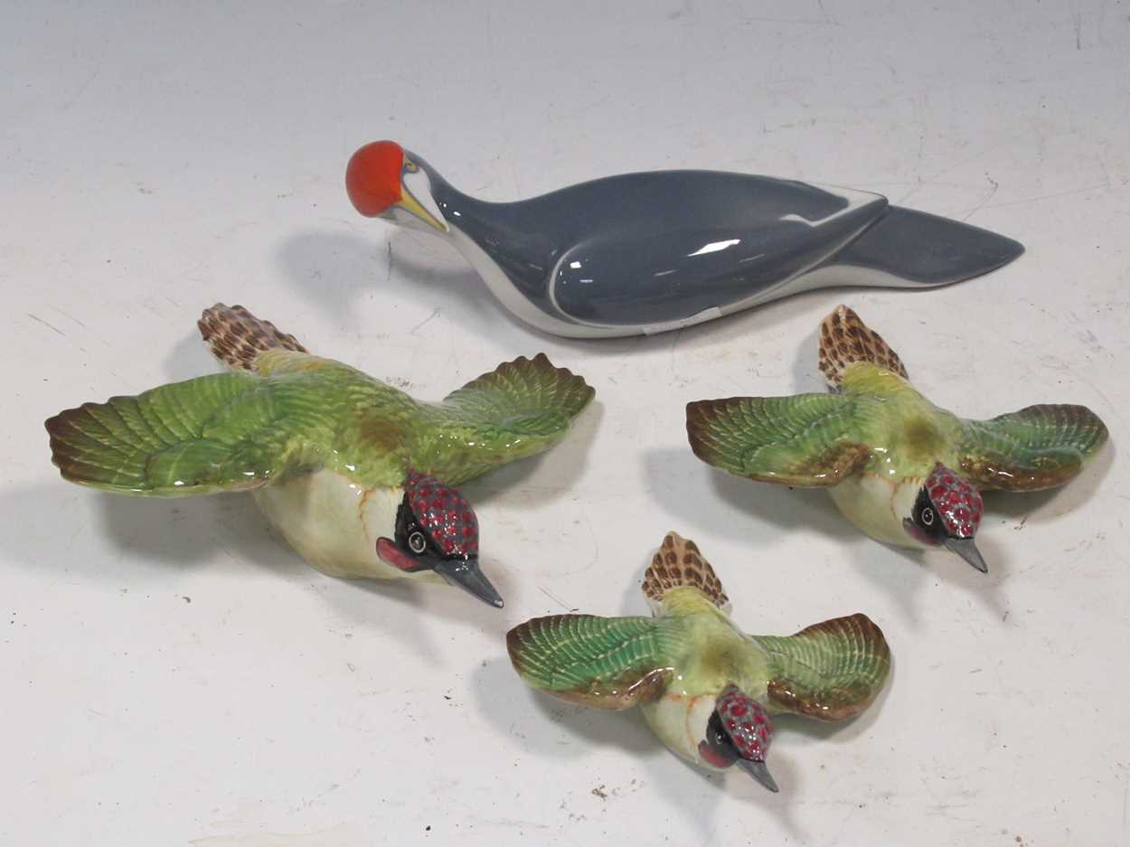 Lot 185 - A set of three Beswick flying Woodpeckers...