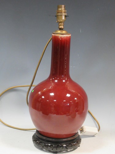 Lot 120 - A sang de boeuf table lamp with an...