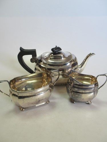 Lot 248 - A Chester silver three-piece tea set, gross...