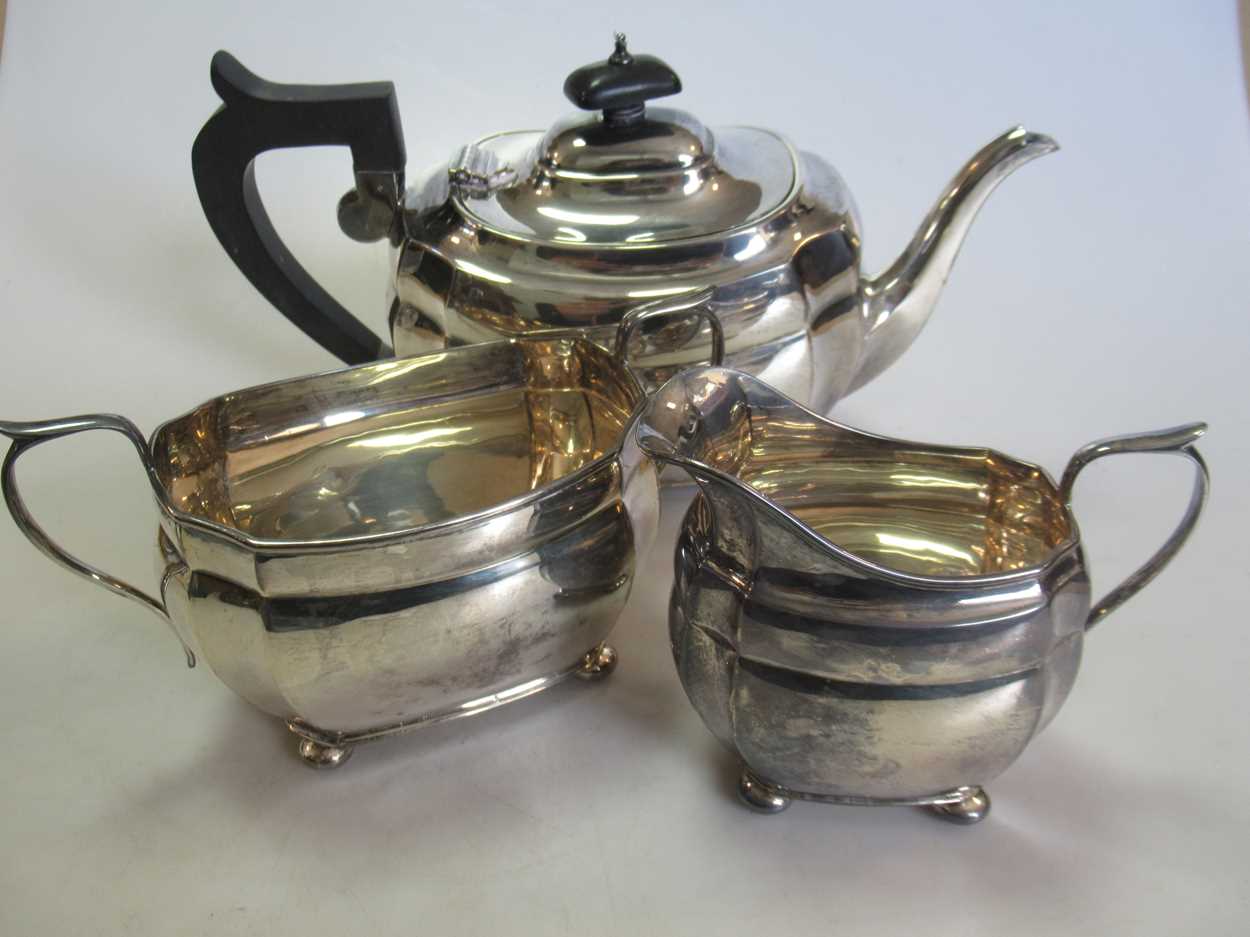 Lot 248 - A Chester silver three-piece tea set, gross...
