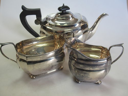 Lot 248 - A Chester silver three-piece tea set, gross...