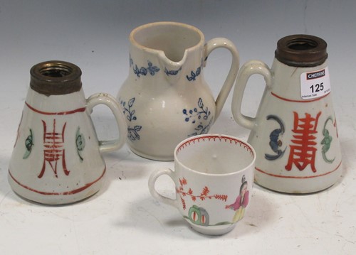 Lot 125 - An 18th century blue and white jug with a side...