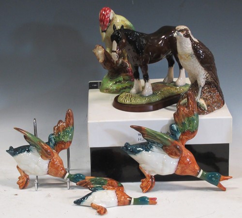 Lot 58 - A graduated set of three Beswick flying ducks,...