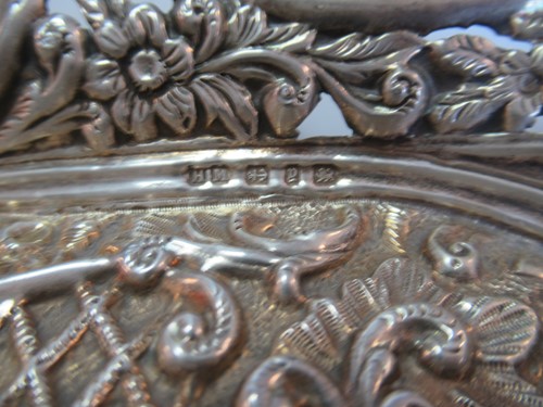 Lot 250 - A hallmarked silver dish by Henry Matthews,...