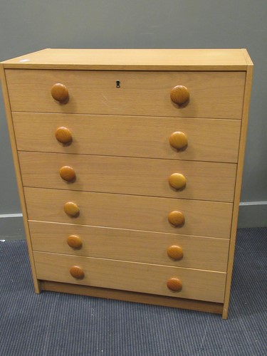 Lot 562 - A 20th century Danish blonde oak effect chest of six long drawers