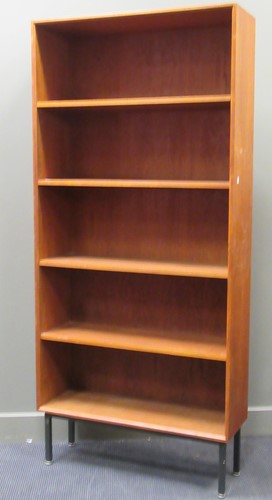 Lot 532 - A 20th century floor standing bookshelf raised on square section metal legs