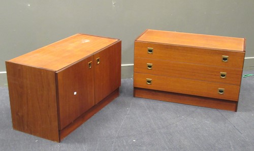 Lot 561 - A pair of teak low side cabinets with sunk metal handles (2)