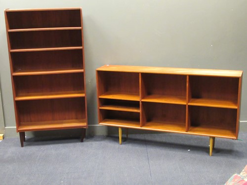 Lot 542 - A 20th century teak side cabinet on tapered legs with an open bookshelf