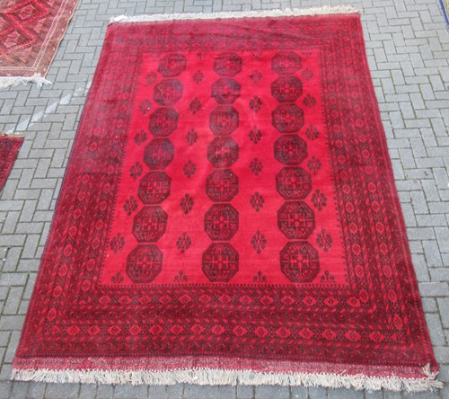 Lot 574 - A modern Afgan rug and a smaller Afgan rug (2)