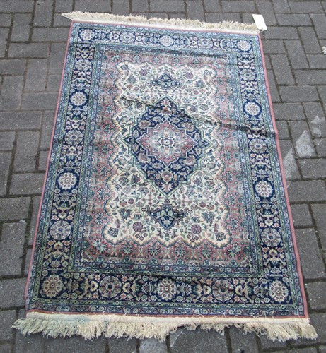 Lot 576 - A Persian style rug, a pink ground rug, a black ground rug and another (4)