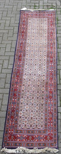 Lot 577 - A modern caucasian style runner 303 x 77cm