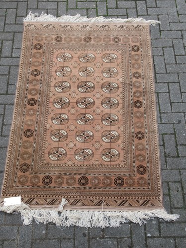 Lot 578 - A modern Tekke rug with orange ground, together with another rug (2)