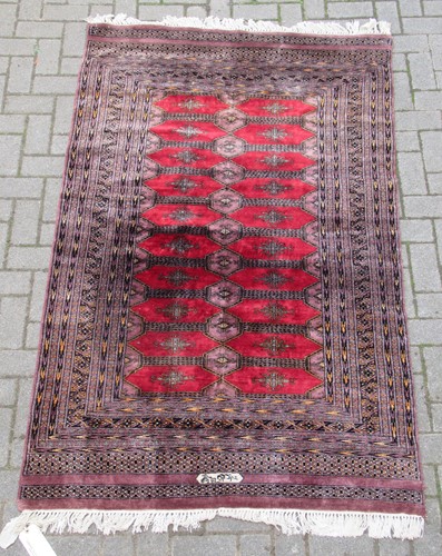 Lot 572 - A Bokhara rug. signed, 210 x 122cm