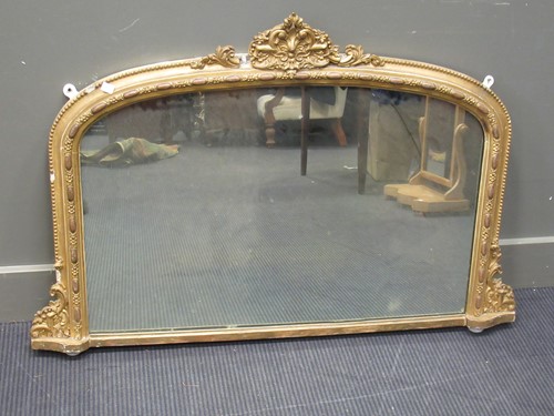 Lot 429 - A Victorian gilt overmantle mirror of arched...