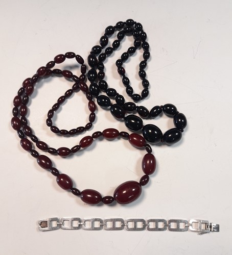 Lot 201 - Two rows of Bakelite beads and a vintage...
