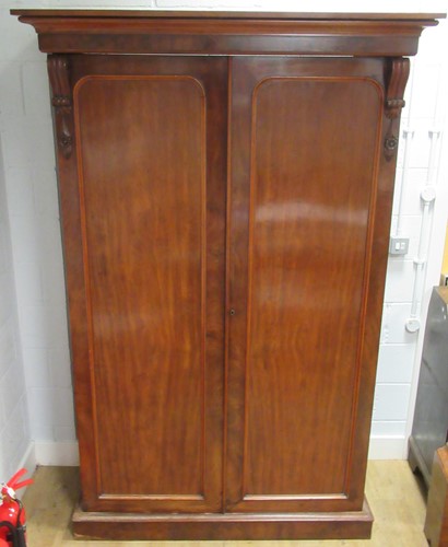 Lot 514 - A late 19th century mahogany two door wardrobe,...