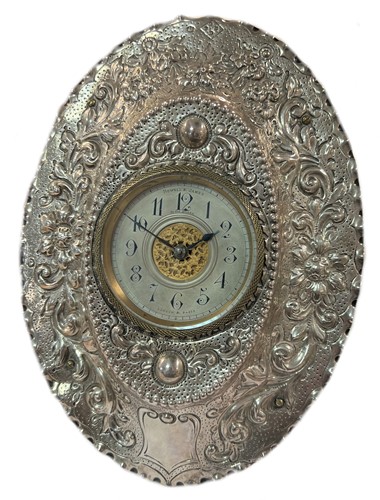 Lot 356 - Howell & James, London - A late 19th century Sterling silver fronted dressing table timepiece