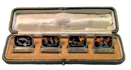 Lot 418 - A cased set of early 20th century silver and tortoiseshell menu holders