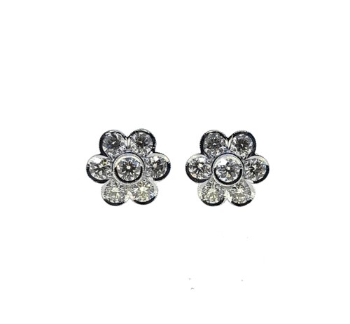 Lot 235 - A pair of daisy style diamond cluster ear studs