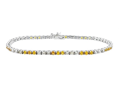 Lot 204 - A yellow sapphire and diamond line bracelet